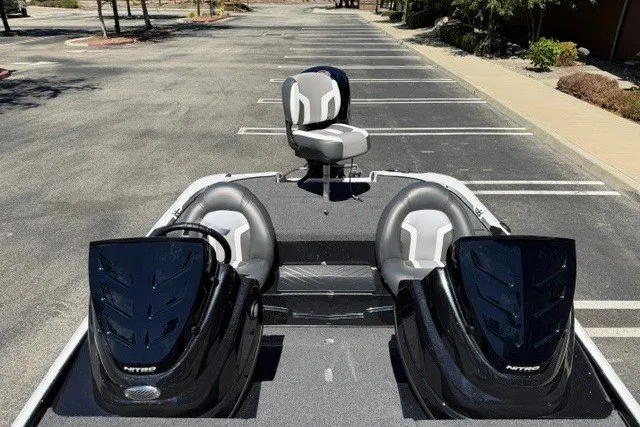 Slide: The Image of 2026 Nitro Z17 boat with dual consoles in a parking lot. - 8