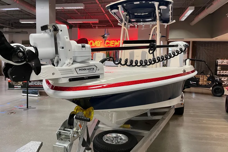 Slide: The Image of 2026 Ranger 2510 Bay boat with Minn Kota motor on display in showroom. - 3