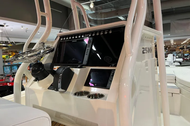 Slide: The Image of 2026 Ranger 2510 Bay boat console with steering wheel and electronic displays. - 7