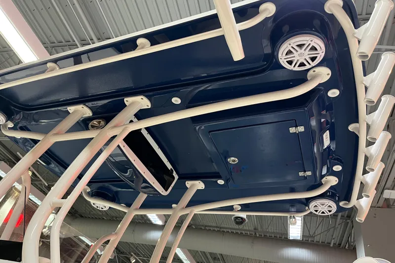 Slide: The Image of 2026 Ranger 2510 Bay boat underside view with speakers and rod holders. - 9