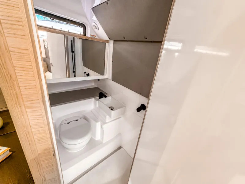 Slide: The Image of 2024 Axopar 45 ST BRABUS Trim Mediterrana bathroom interior, featuring modern fixtures and sleek design. - 18