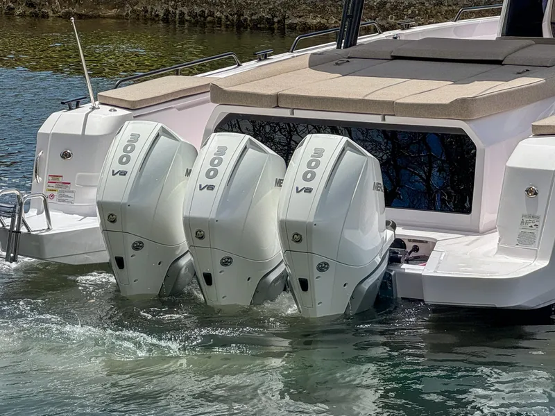 Slide: The Image of 2024 Axopar 45 ST BRABUS Trim Mediterrana with triple 300 V8 engines in water. - 2