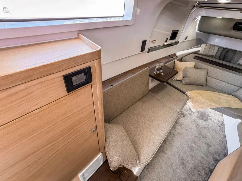 Slide: The Image of 2024 Axopar 45 ST BRABUS Trim Mediterrana interior with modern seating and wooden accents. - 20