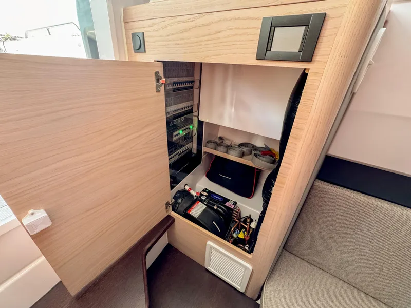 Slide: The Image of Interior view of 2024 Axopar 45 ST BRABUS Trim Mediterrana storage compartment. - 29