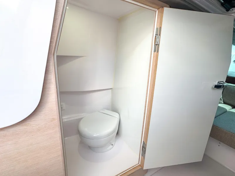 Slide: The Image of 2024 Axopar 45 ST BRABUS Trim Mediterrana boat bathroom interior with modern toilet. - 30