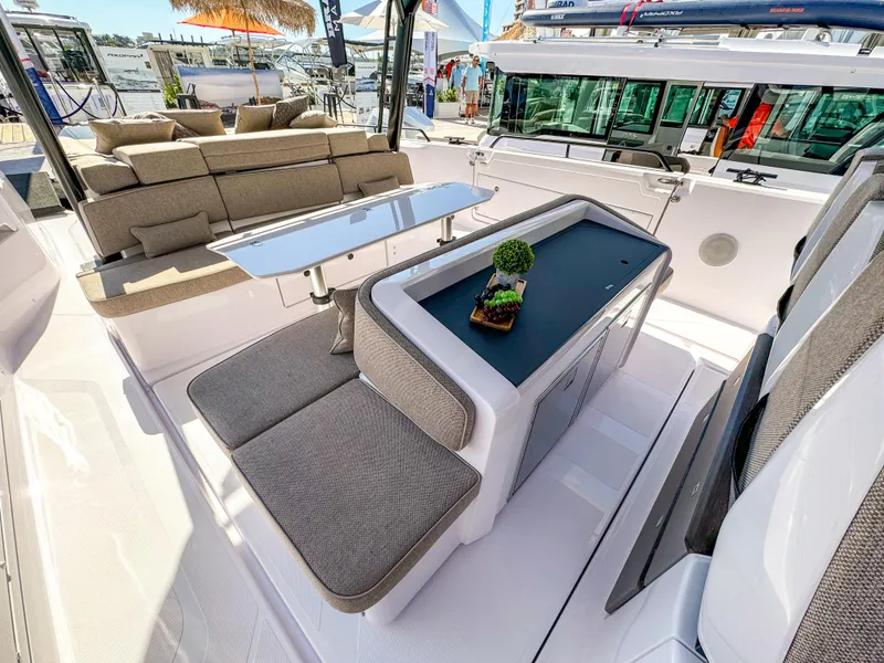 Slide: The Image of 2024 Axopar 45 ST BRABUS Trim Mediterrana luxury yacht interior with elegant seating and table. - 7