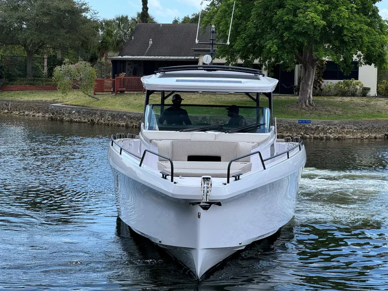 Slide: The Image of 2024 Axopar 45 ST BRABUS Trim Mediterrana cruising on a calm waterway. - 35