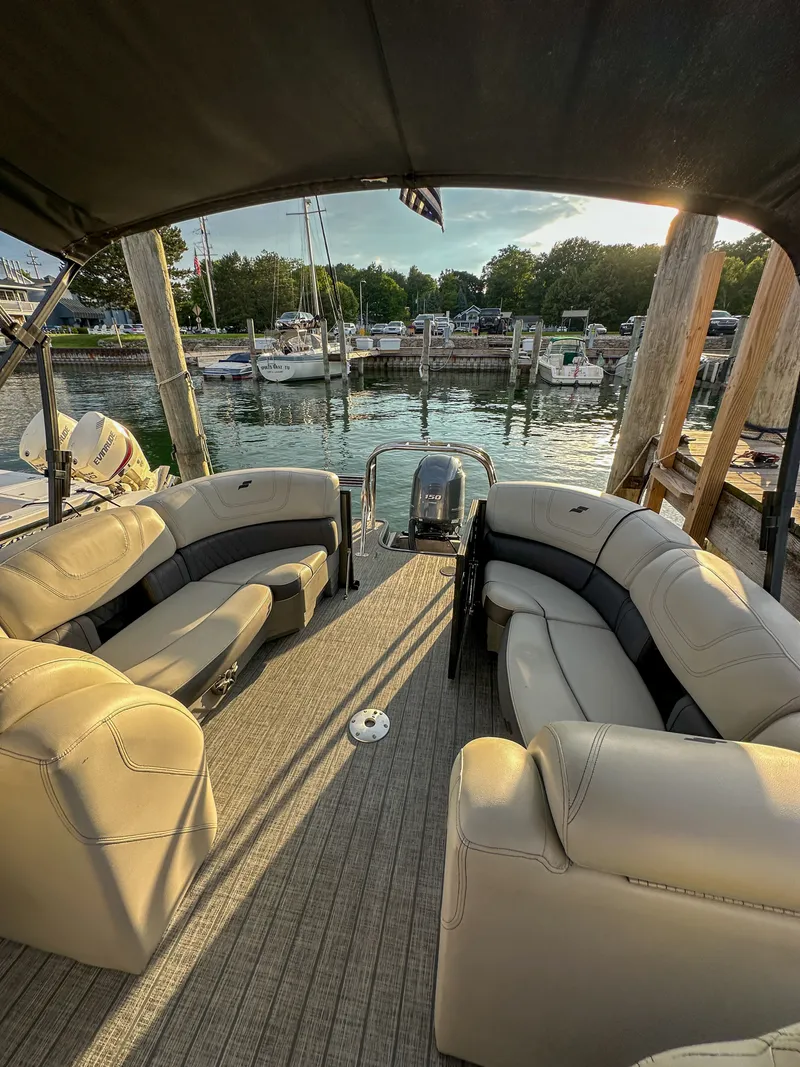 Slide: The Image of Interior view of a 2021 Starcraft 25 SLS pontoon boat at the dock. - 10