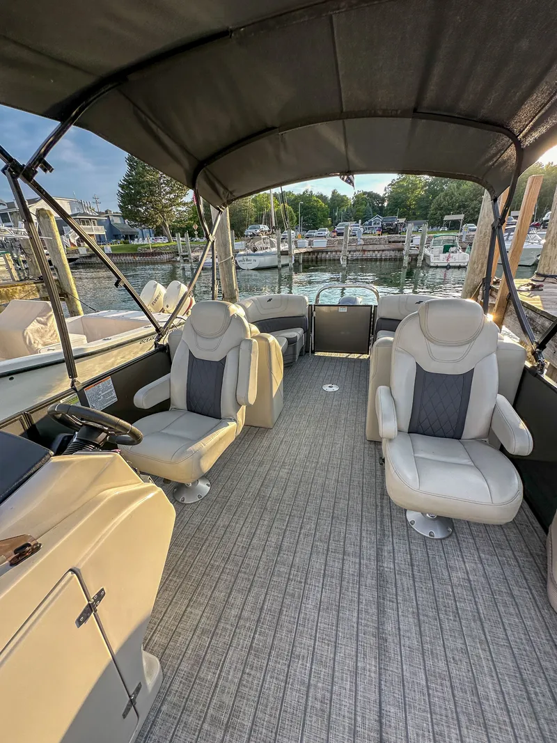 Slide: The Image of Interior of a 2021 Starcraft 25 SLS boat with luxurious seating. - 12
