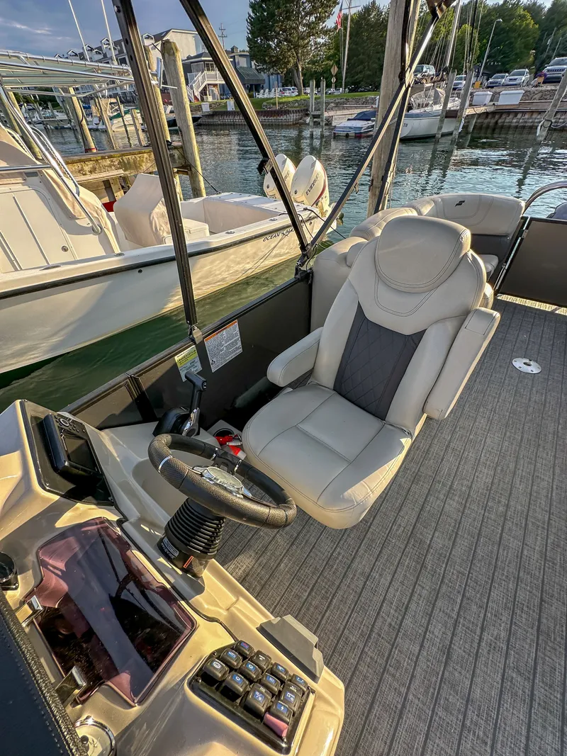 Slide: The Image of Interior of a 2021 Starcraft 25 SLS boat at the dock. - 13