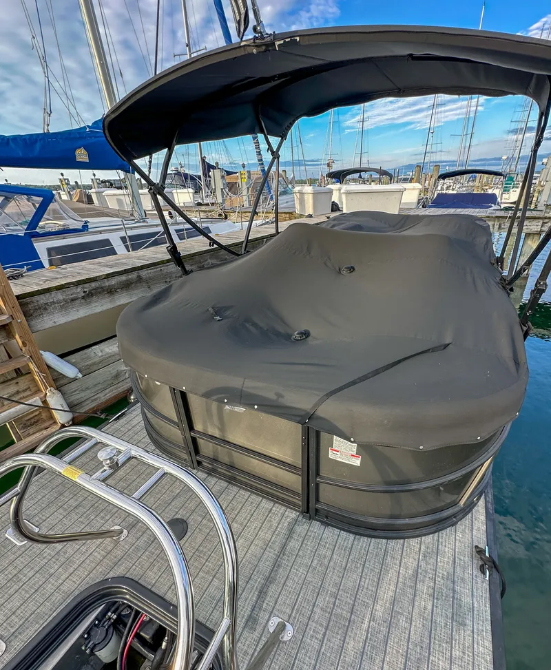Slide: The Image of 2021 Starcraft 25 SLS boat with cover at marina. - 30