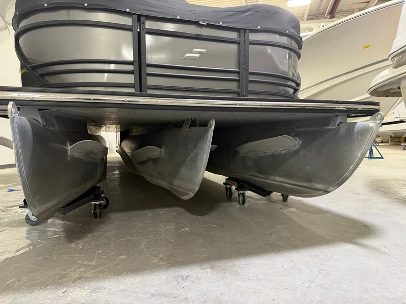 Slide: The Image of Underside of a 2021 Starcraft 25 SLS pontoon boat in a storage facility. - 43