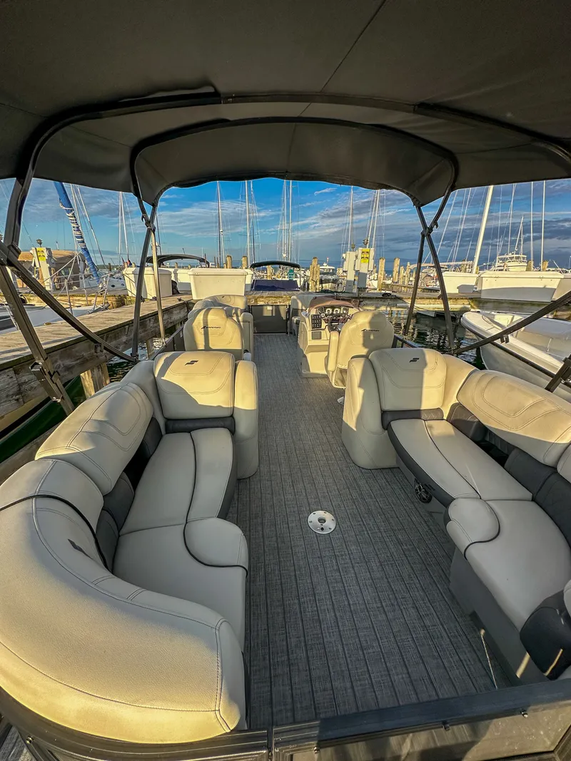 Slide: The Image of Interior view of a 2021 Starcraft 25 SLS pontoon boat at the dock. - 9