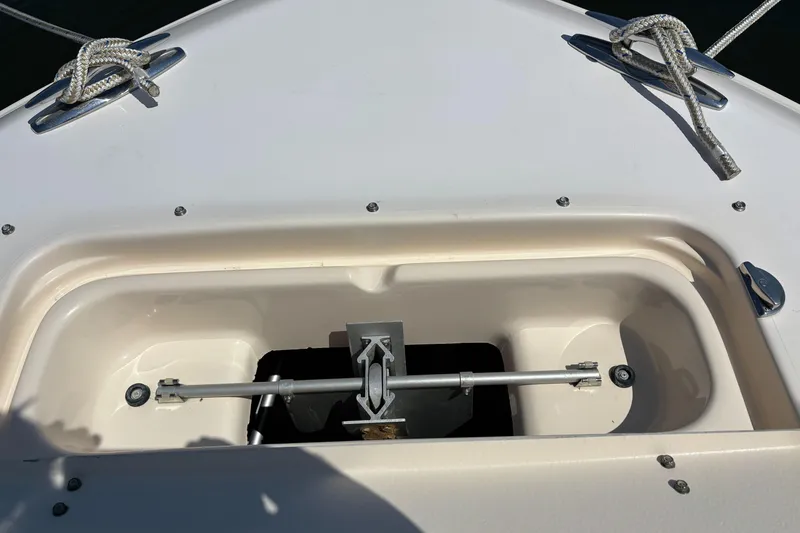 Slide: The Image of Anchor compartment of 2011 Grady-White Freedom 275 boat with secured ropes. - 18