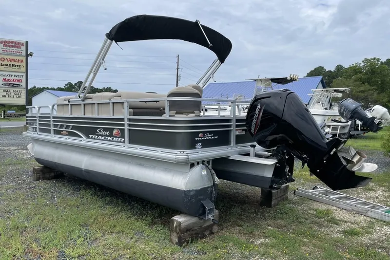 Slide: The Image of 2023 Sun Tracker Fishin' Barge 20 DLX pontoon boat with Mercury outboard motor. - 5