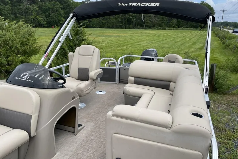 Slide: The Image of 2023 Sun Tracker Fishin' Barge 20 DLX pontoon boat with spacious seating and canopy. - 8