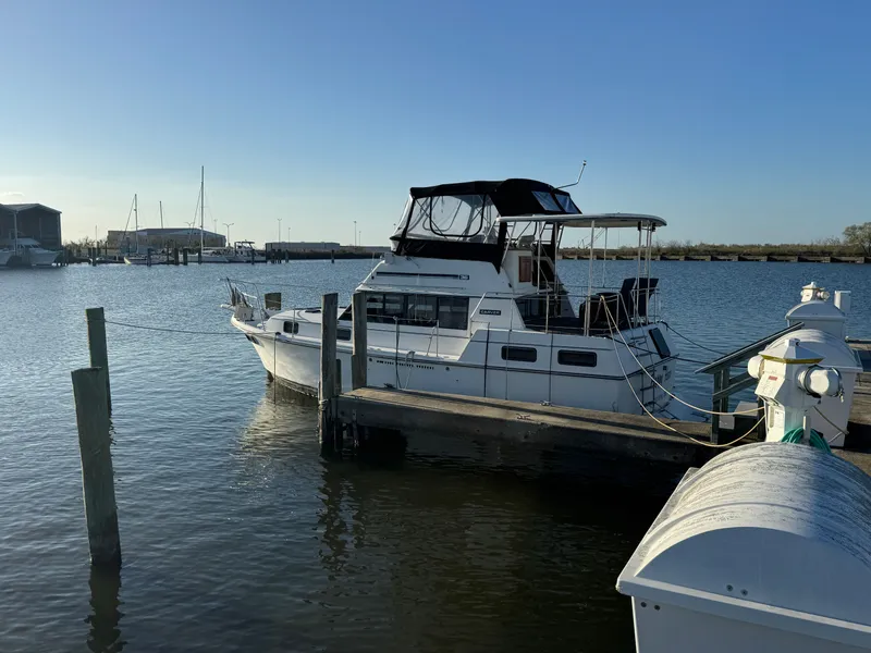 Slide: The Image of 1987 Carver 3607 Aft Cabin Motor Yacht docked at marina. - 1
