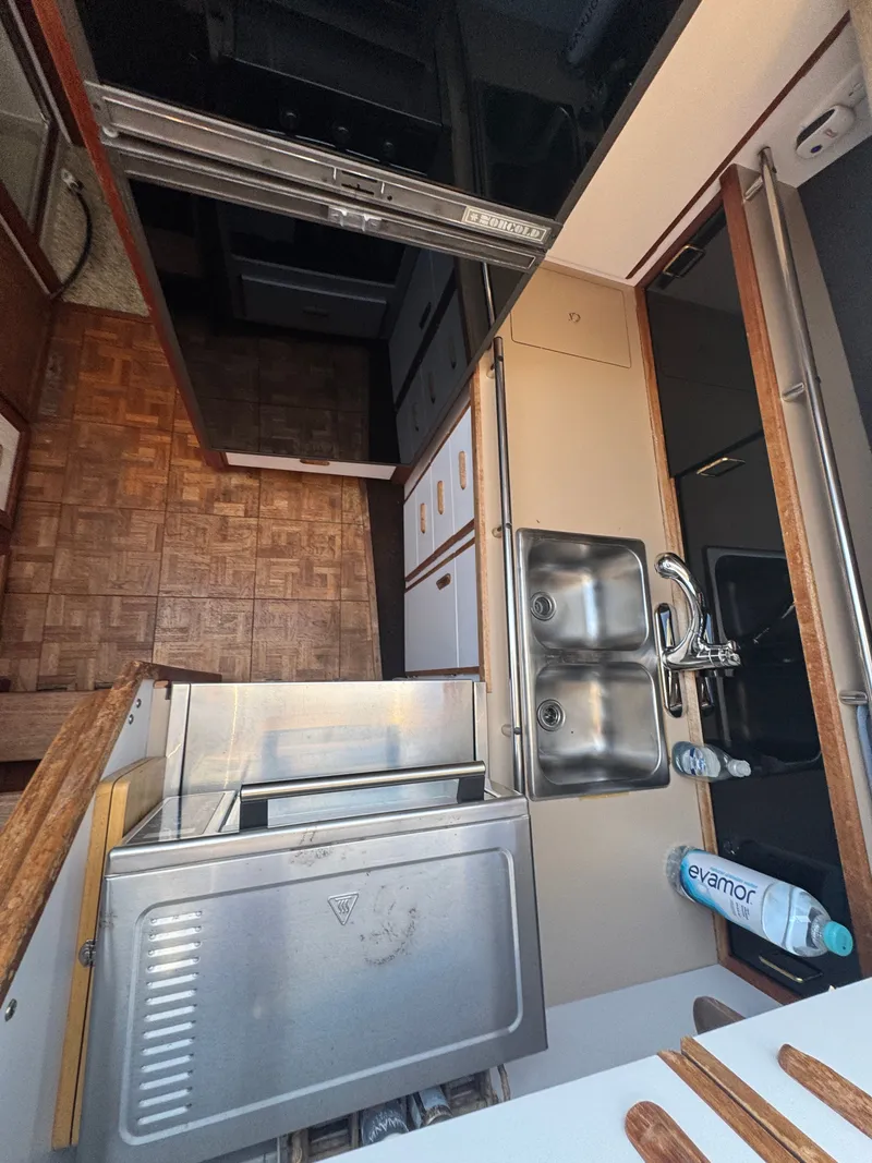 Slide: The Image of Interior of 1987 Carver 3607 yacht kitchen area. - 11
