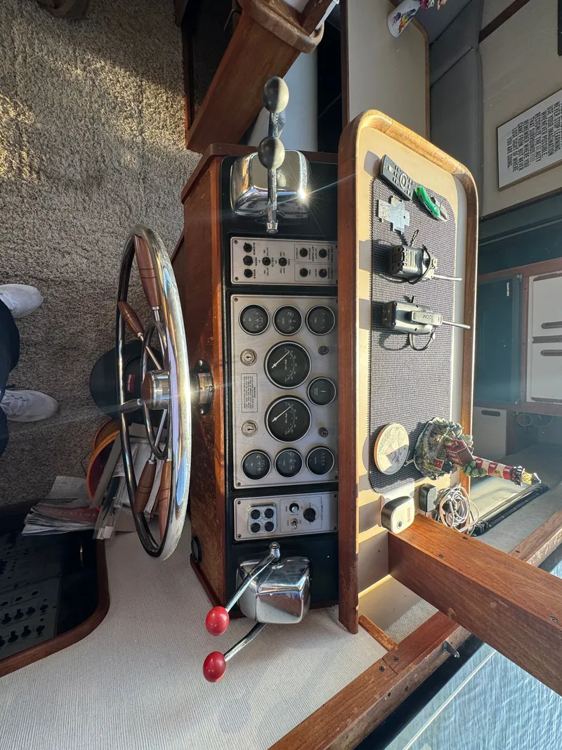Slide: The Image of 1987 Carver 3607 Aft Cabin Motor Yacht helm console. - 16