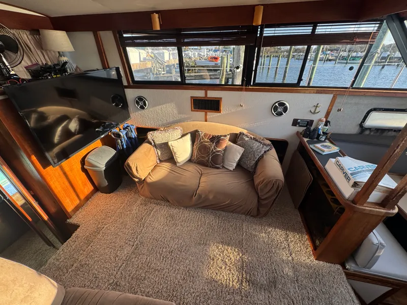 Slide: The Image of Interior of 1987 Carver 3607 Yacht with sofa and TV. - 17