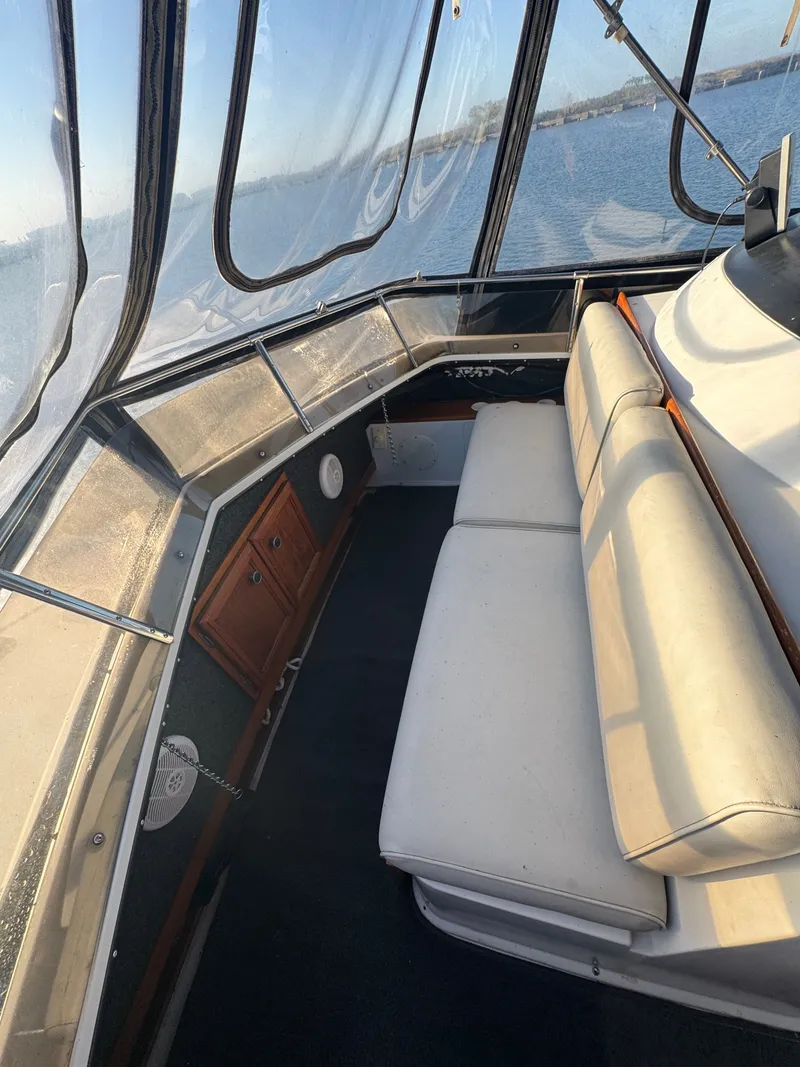 Slide: The Image of Interior of a 1987 Carver 3607 yacht with seating and wooden cabinets. - 24