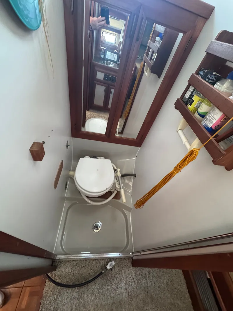 Slide: The Image of Carver 3607 Yacht bathroom with toilet and mirror, 1987 model. - 4