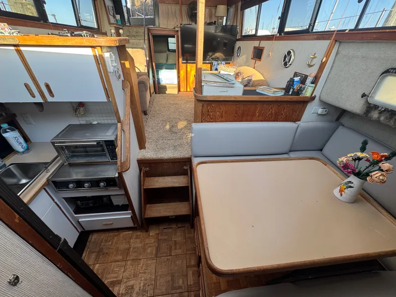 Slide: The Image of Interior of 1987 Carver 3607 Yacht with kitchen and dining area. - 6