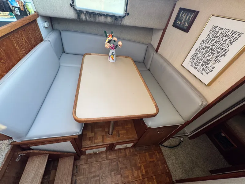 Slide: The Image of Interior of 1987 Carver 3607 Yacht with cozy seating area. - 8