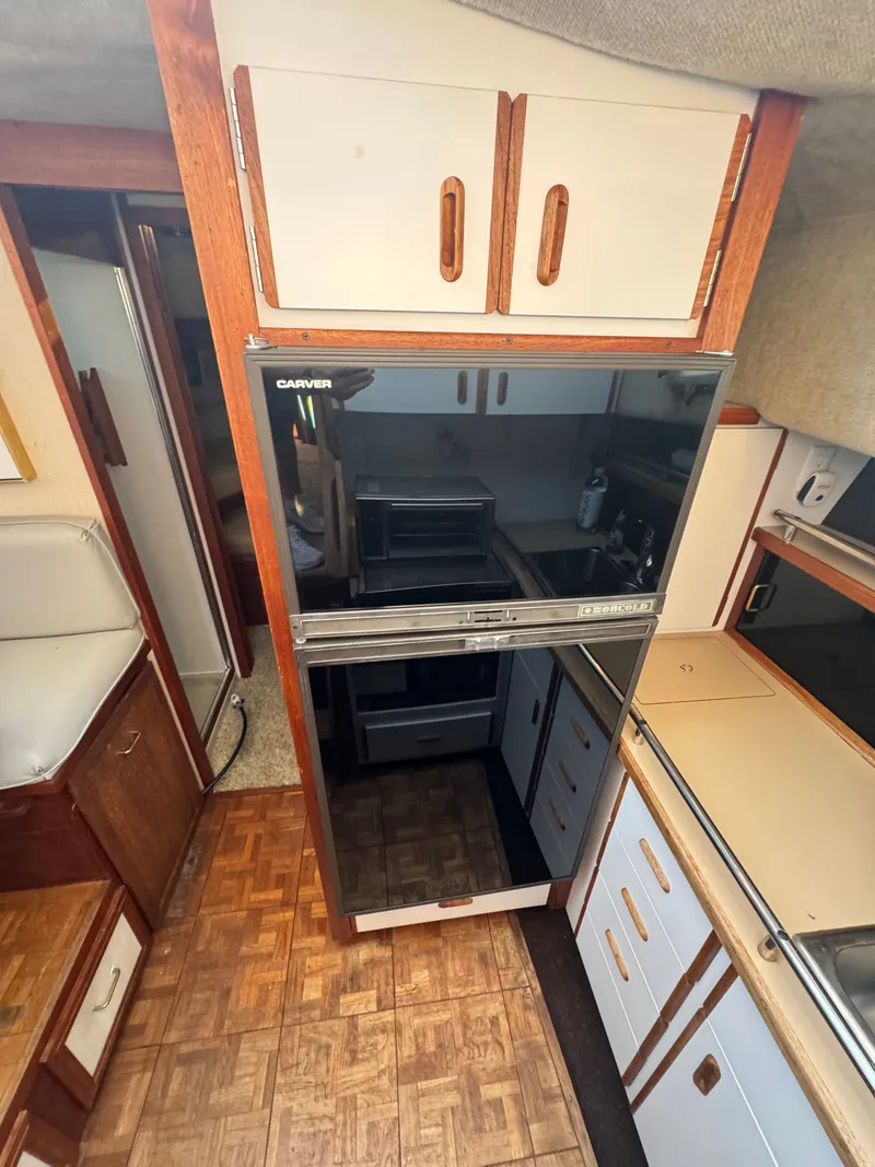 Slide: The Image of Interior of 1987 Carver 3607 yacht kitchen area. - 10