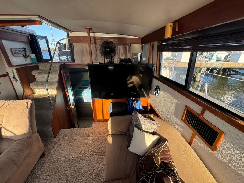 Slide: The Image of Interior of 1987 Carver 3607 Yacht with sofa and TV. - 19