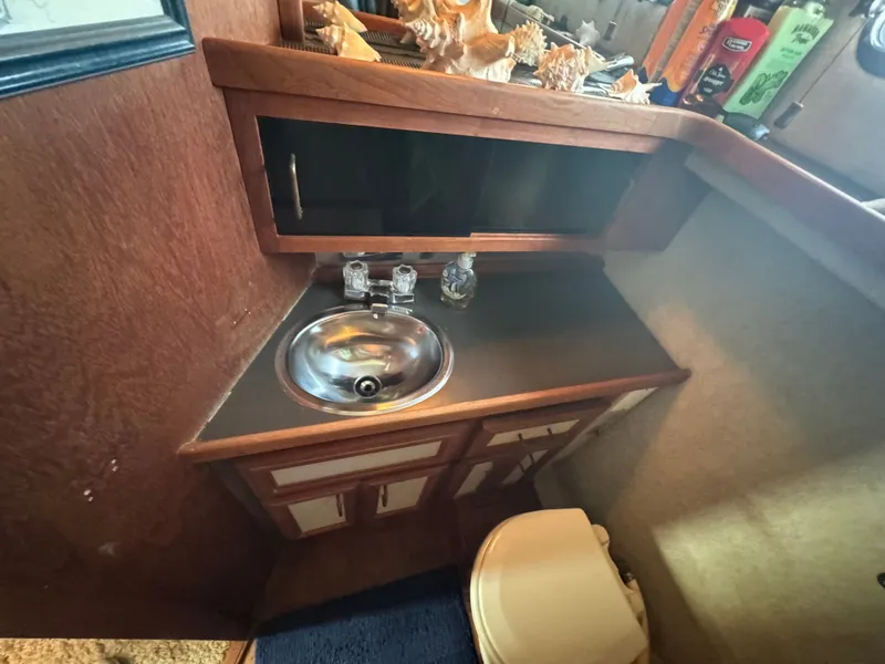 Slide: The Image of Interior of 1987 Carver 3607 Yacht with sink and cabinets. - 21