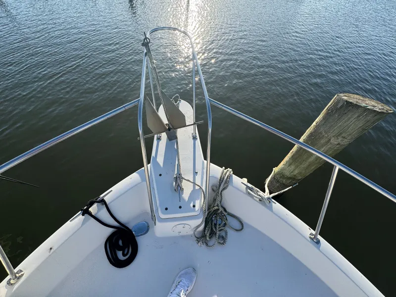 Slide: The Image of Bow view of 1987 Carver 3607 yacht on calm water. - 28