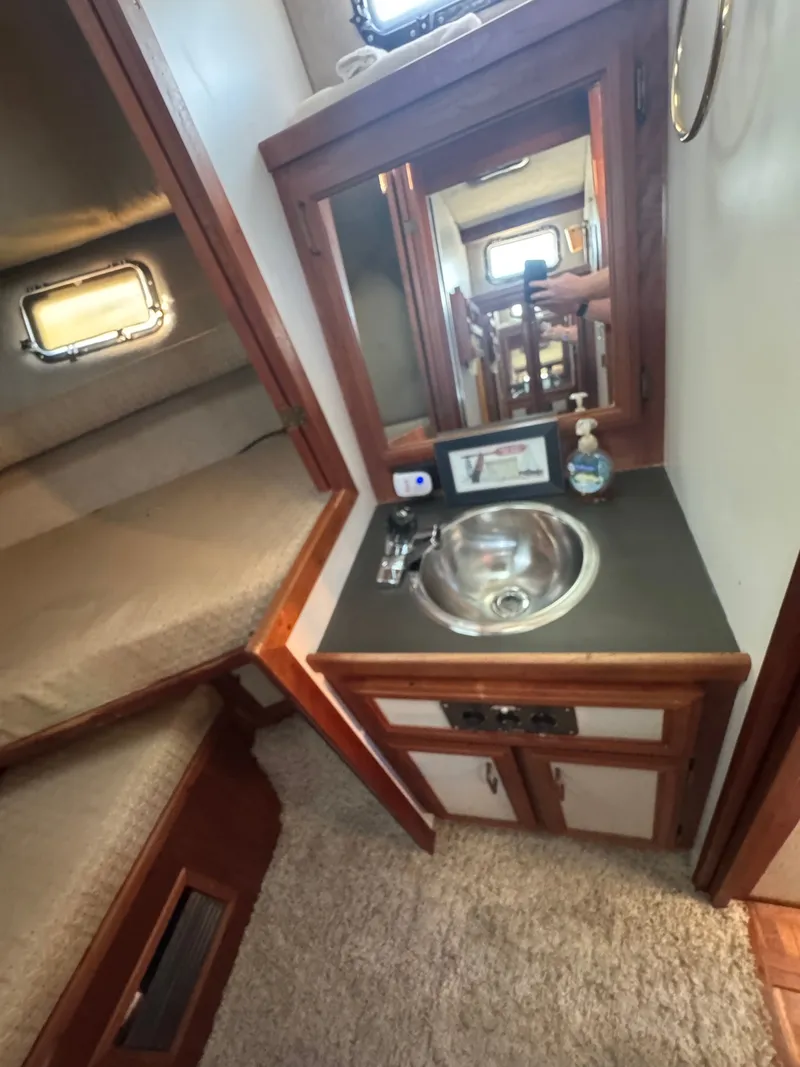 Slide: The Image of Interior of 1987 Carver 3607 Yacht with sink and mirror. - 5