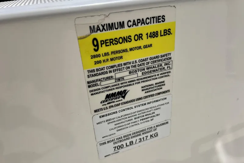 Slide: The Image of Capacity label on 2023 Boston Whaler 210 Montauk, max 9 persons or 1488 lbs. - 16