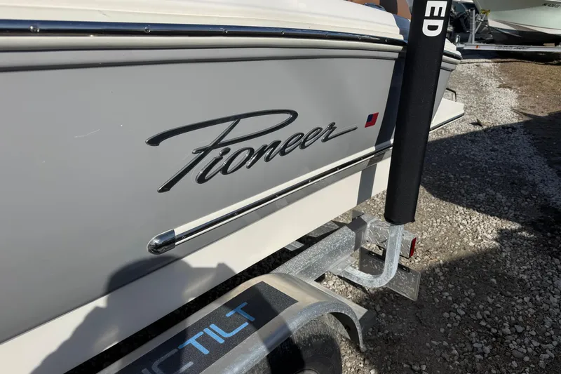 Slide: The Image of 2023 Pioneer 202 Islander boat on trailer, side view with logo. - 3