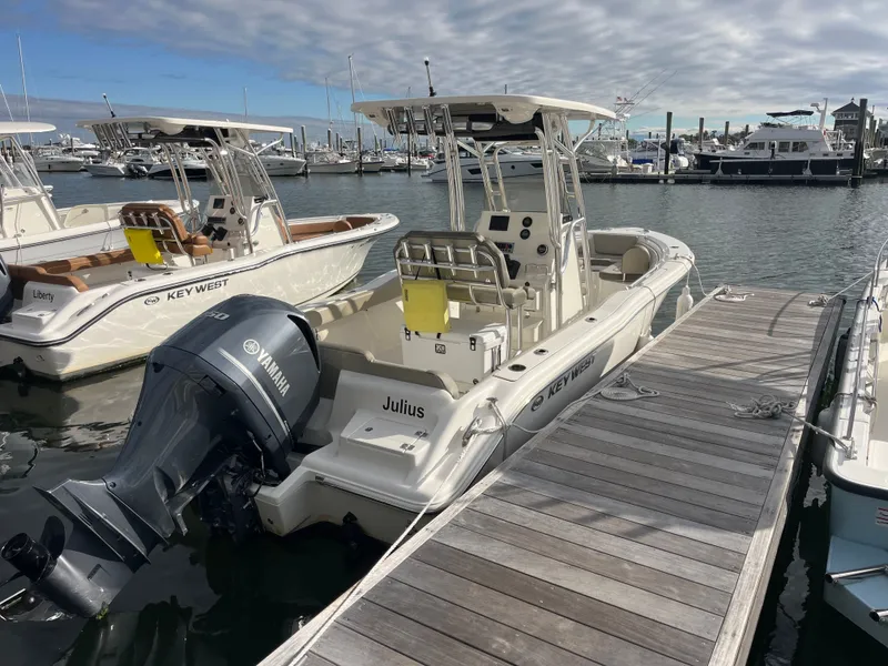 Slide: The Image of 2024 Key West 239 FS boat docked with Yamaha engine. - 2
