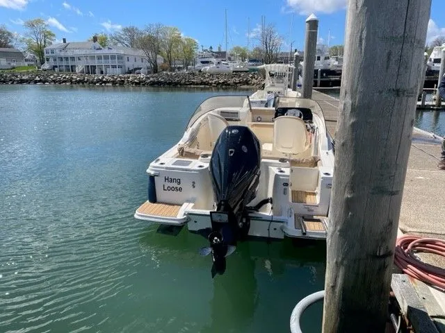 Slide: The Image of 2023 Scout 215 Dorado boat docked at marina. - 2