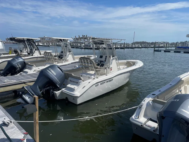 Slide: The Image of 2023 Key West 219 FS boat docked at marina. - 3