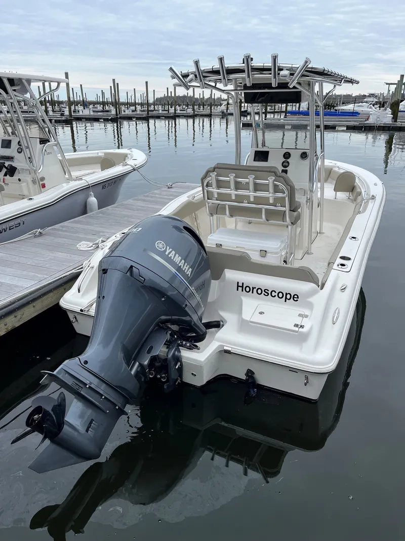 Slide: The Image of 2023 Key West 219 FS boat docked with Yamaha engine. - 6
