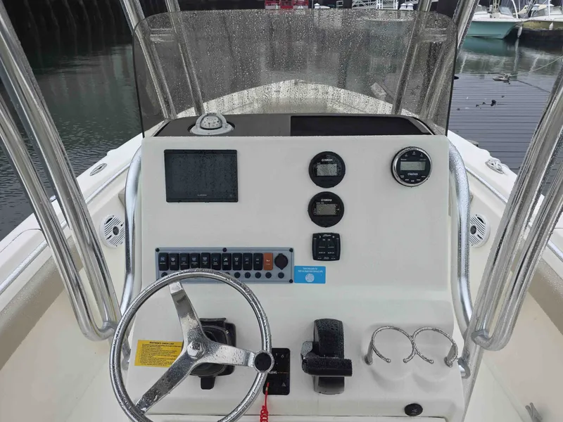 Slide: The Image of Control console of a 2023 Key West 219 FS boat in harbor. - 8
