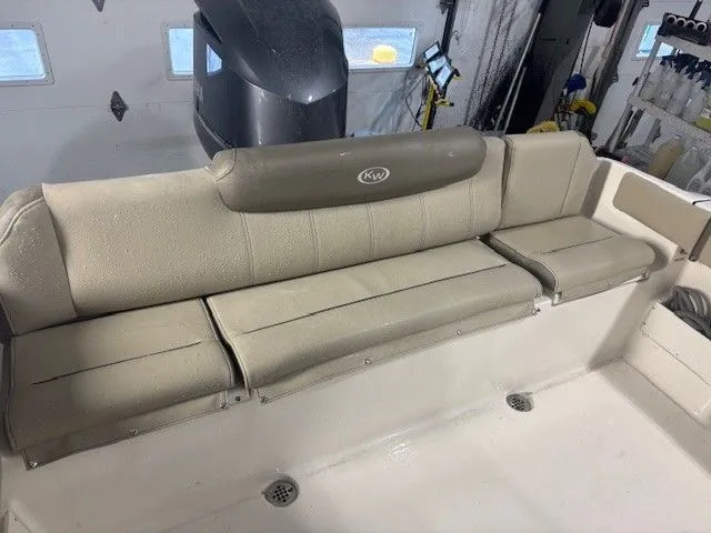 Slide: The Image of Interior of 2024 Key West 239 FS with beige seating area. - 22