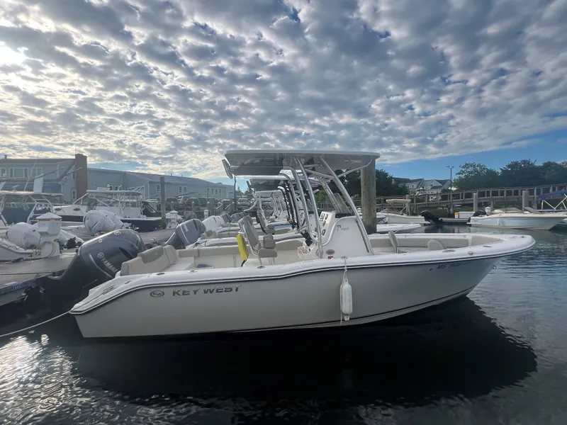 The Image of 2024 Key West 239 FS boat docked under cloudy sky. - 0
