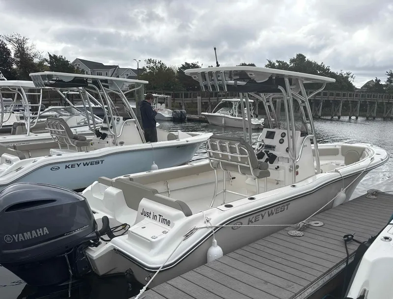 Slide: The Image of 2024 Key West 239 FS boat docked with Yamaha engine. - 2