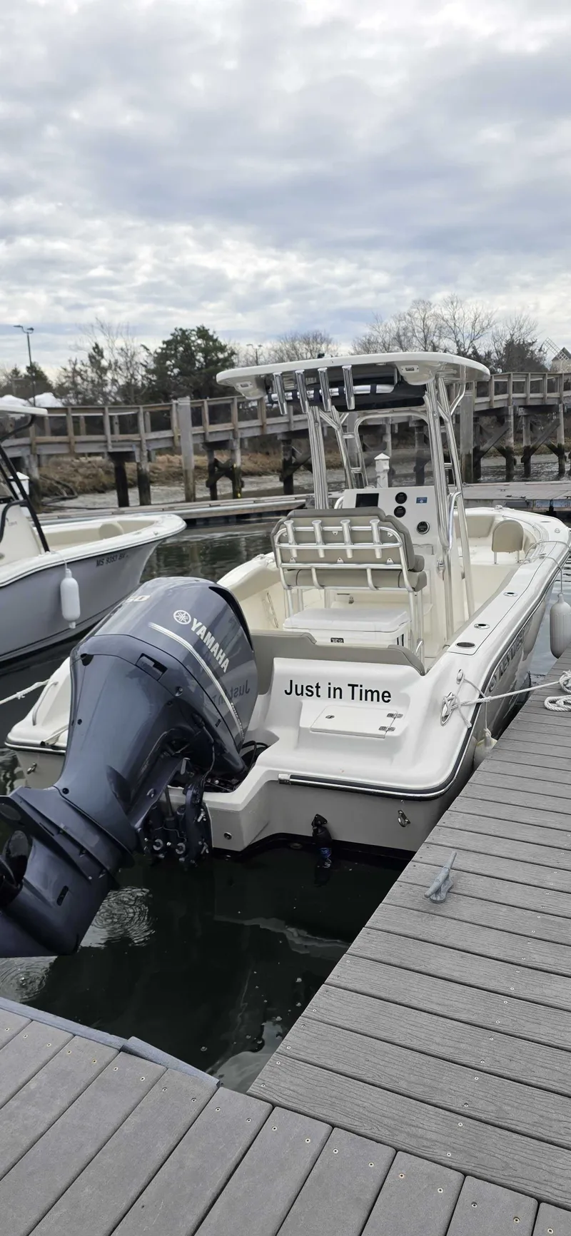 Slide: The Image of 2024 Key West 239 FS boat docked at marina. - 4