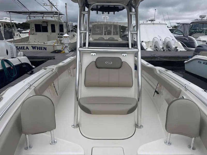 Slide: The Image of 2024 Key West 239 FS boat in harbor, gray upholstery. - 9