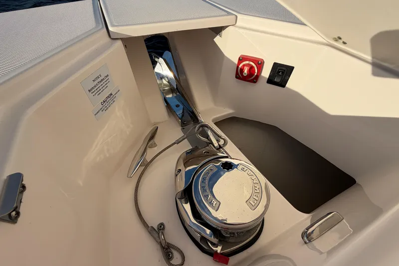 Slide: The Image of Anchor system on 2021 Regal 38 SAV boat, featuring Lewmar equipment and control panel. - 14