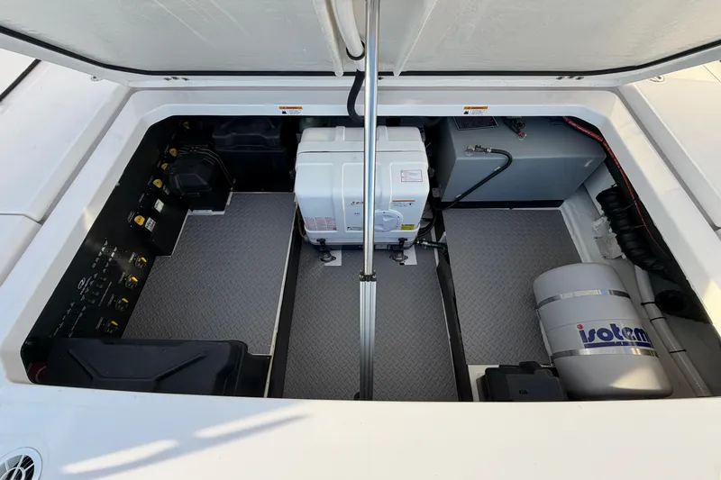 Slide: The Image of Engine compartment of 2021 Regal 38 SAV boat with equipment and storage. - 20