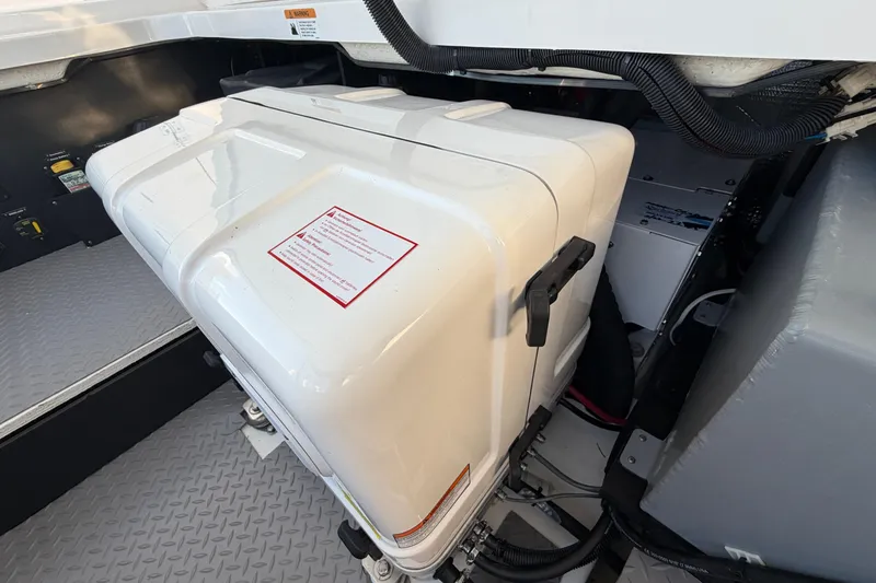 Slide: The Image of Engine compartment of a 2021 Regal 38 SAV boat, showcasing equipment and wiring. - 21