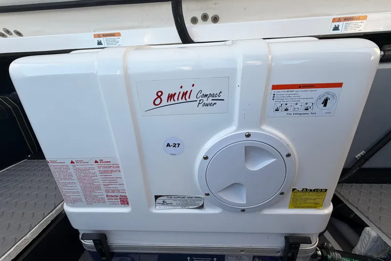 Slide: The Image of 2021 Regal 38 SAV boat with 8 Mini Compact Power generator, featuring safety warnings. - 22