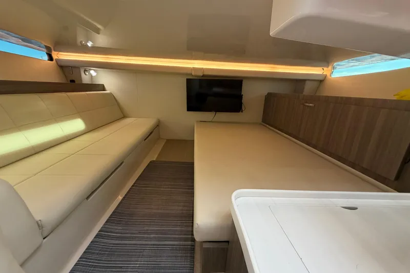Slide: The Image of Interior of 2021 Regal 38 SAV yacht with modern seating and TV. - 25